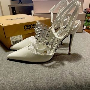 White patent leather heels with spike strap